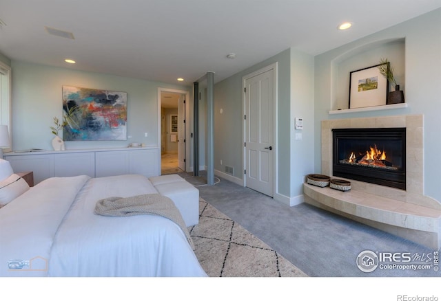 3747 Mountain Laurel Pl, Boulder, CO 80304 - carpeted bedroom featuring a tile fireplace and recessed lighting