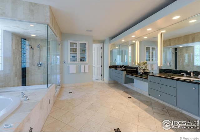 3747 Mountain Laurel Pl, Boulder, CO 80304 - full bath featuring a shower stall, vanity, tile patterned floors, a bath, and recessed lighting