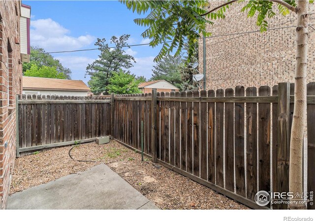 911 Tulip St Unit C, Longmont, CO 80501 - fenced backyard featuring a patio area