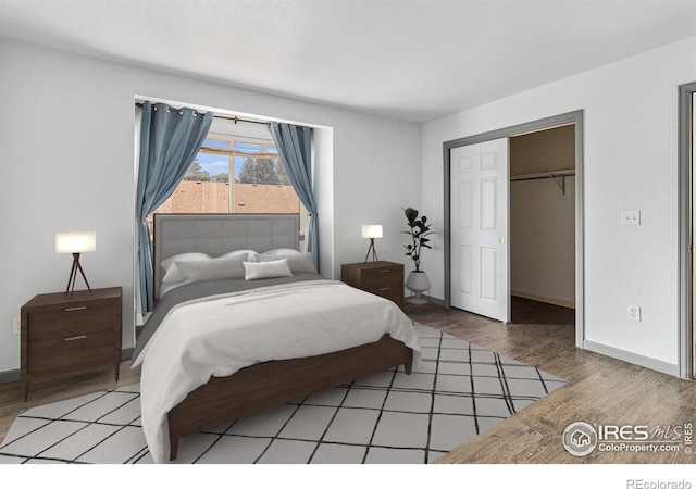 911 Tulip St Unit C, Longmont, CO 80501 - bedroom featuring light wood-type flooring and a closet
