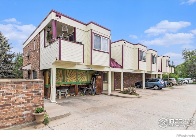 911 Tulip St Unit C, Longmont, CO 80501 - view of building exterior featuring uncovered parking