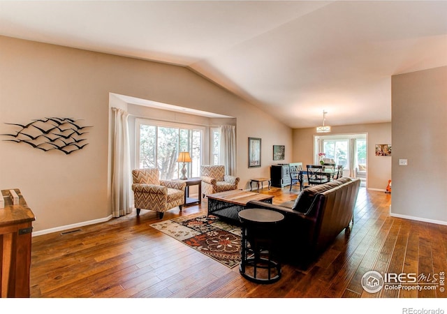 1331 Iva Ct, Fort Collins, CO 80525 - living area with vaulted ceiling and hardwood / wood-style flooring