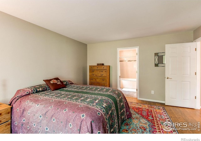 1331 Iva Ct, Fort Collins, CO 80525 - bedroom featuring wood finished floors and ensuite bath