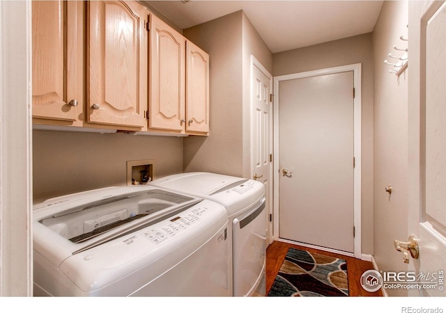 1331 Iva Ct, Fort Collins, CO 80525 - laundry room featuring cabinet space, separate washer and dryer, and wood finished floors