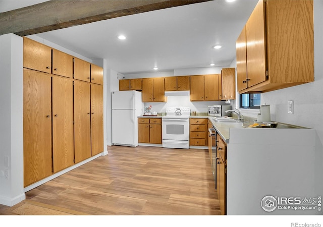 3880 Telluride Pl, Boulder, CO 80305 - kitchen featuring white appliances, light wood-style flooring, under cabinet range hood, recessed lighting, and brown cabinets