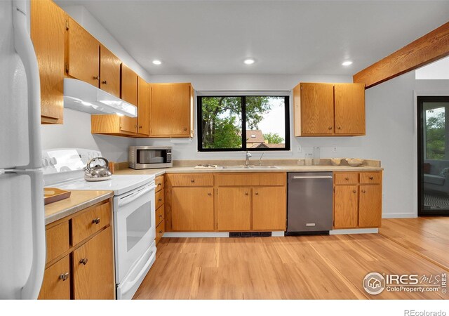 3880 Telluride Pl, Boulder, CO 80305 - kitchen with appliances with stainless steel finishes, exhaust hood, light wood-style floors, light countertops, and healthy amount of natural light
