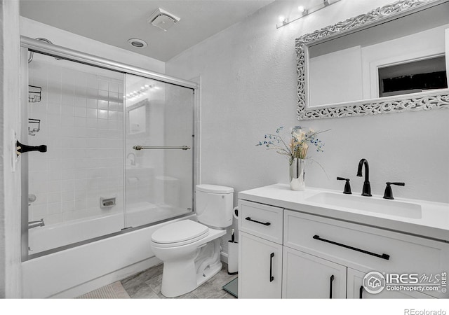 3880 Telluride Pl, Boulder, CO 80305 - full bath with vanity, a textured wall, and enclosed tub / shower combo