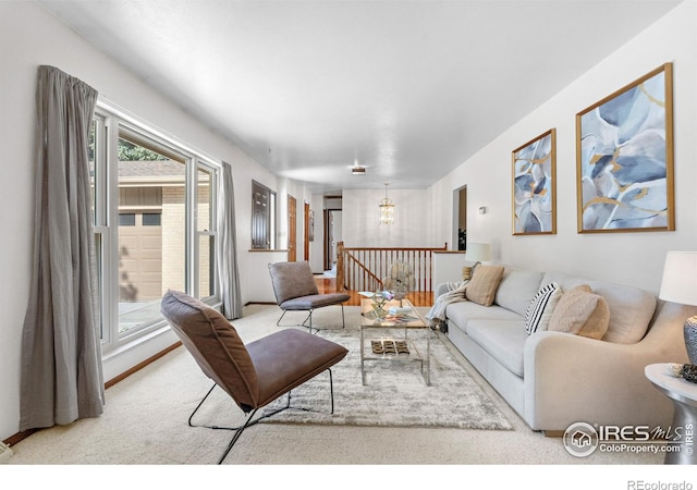 11198 W 59th Pl, Arvada, CO 80004 - carpeted living area with a chandelier