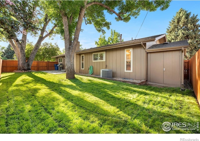11198 W 59th Pl, Arvada, CO 80004 - back of house with a fenced backyard and board and batten siding