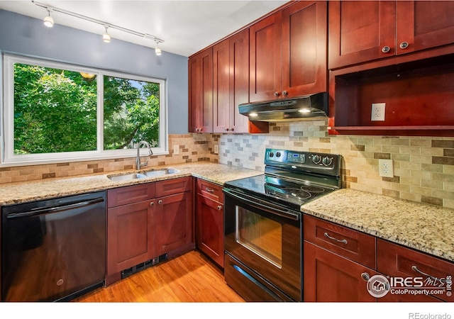 3465 Lochwood Dr Unit 91, Fort Collins, CO 80525 - kitchen with dishwasher, electric range, under cabinet range hood, light wood-style floors, and decorative backsplash