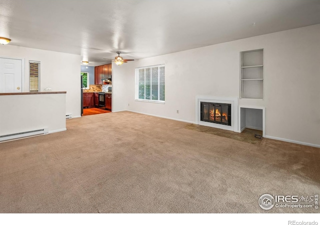 3465 Lochwood Dr Unit 91, Fort Collins, CO 80525 - unfurnished living room with baseboard heating, carpet floors, built in features, a fireplace with flush hearth, and a ceiling fan