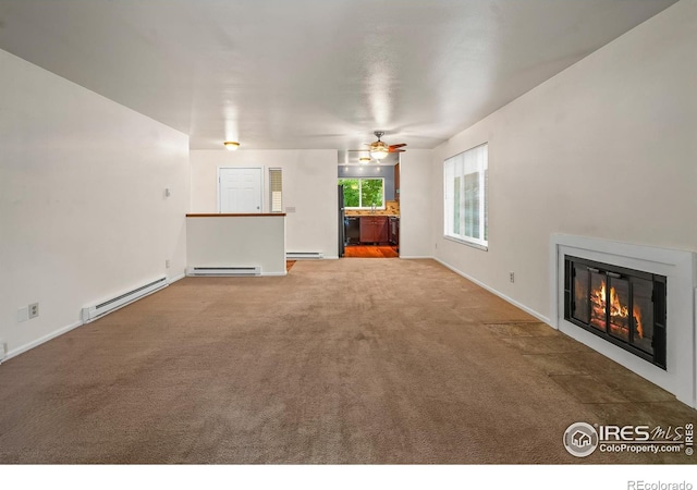 3465 Lochwood Dr Unit 91, Fort Collins, CO 80525 - unfurnished living room with a baseboard heating unit, a fireplace with flush hearth, and ceiling fan