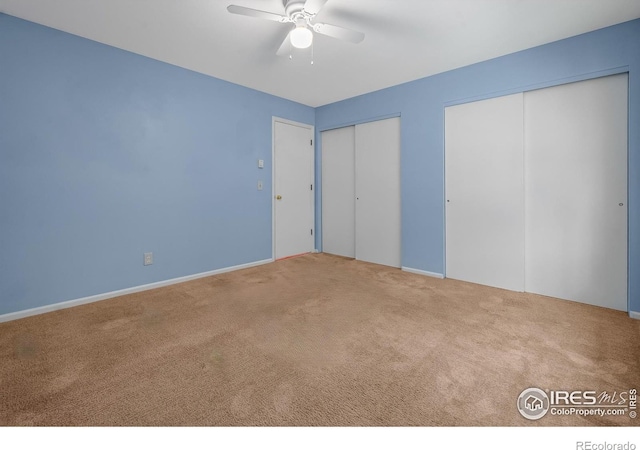 3465 Lochwood Dr Unit 91, Fort Collins, CO 80525 - unfurnished bedroom with carpet floors, multiple closets, and a ceiling fan