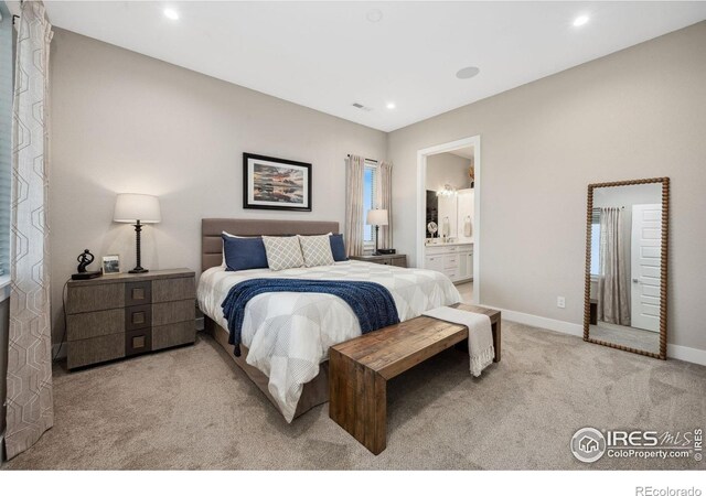 1768 Barefoot Dr, Windsor, CO 80550 - bedroom with light carpet, recessed lighting, and connected bathroom