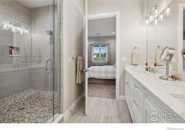 1768 Barefoot Dr, Windsor, CO 80550 - full bathroom with double vanity, a shower stall, and ensuite bath