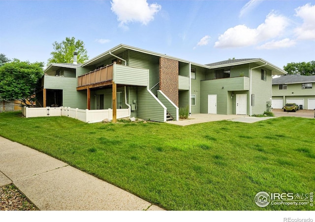 1900 Chalcis Dr Unit 42, Lafayette, CO 80026 - back of property with a yard and a patio