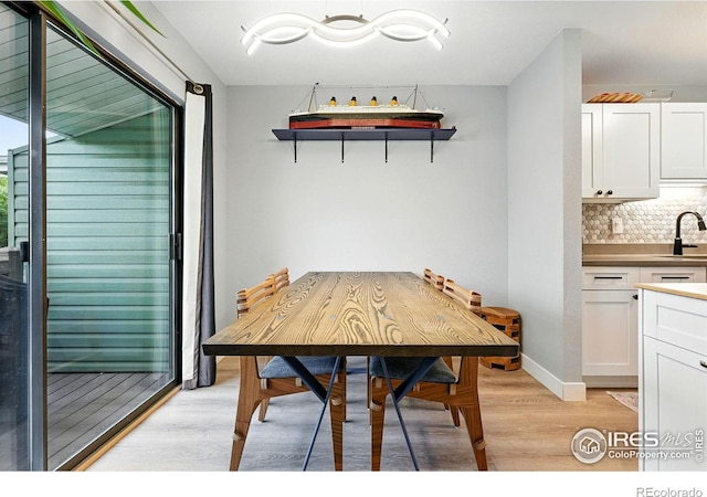 1900 Chalcis Dr Unit 42, Lafayette, CO 80026 - dining area featuring light wood-style flooring and baseboards