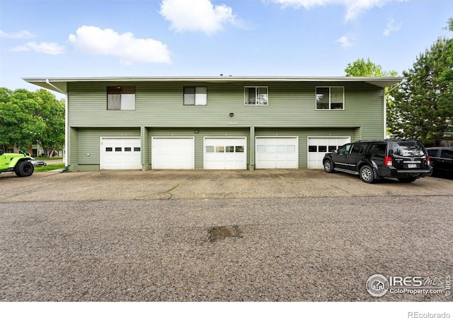 1900 Chalcis Dr Unit 42, Lafayette, CO 80026 - view of front of home with asphalt driveway and a garage