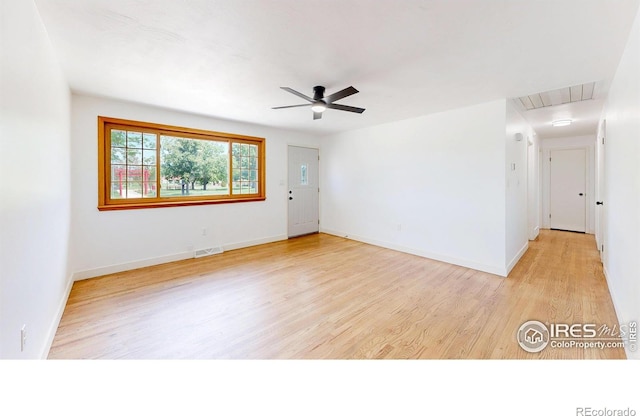 235 N 12th Ave, Brighton, CO 80601 - empty room featuring attic access, light wood finished floors, and a ceiling fan