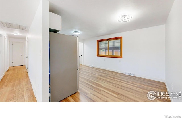 235 N 12th Ave, Brighton, CO 80601 - corridor featuring attic access and light wood-style flooring
