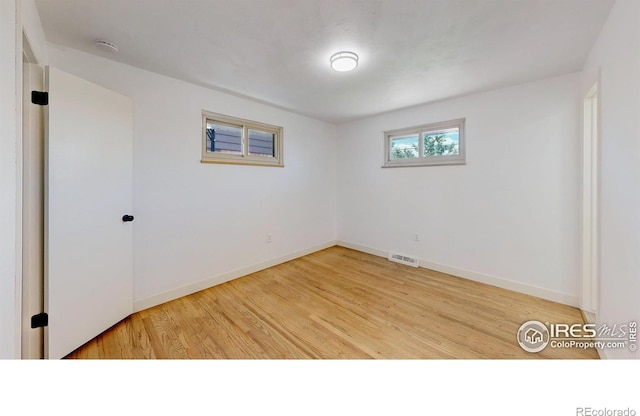 235 N 12th Ave, Brighton, CO 80601 - spare room featuring light wood-type flooring and a smoke detector