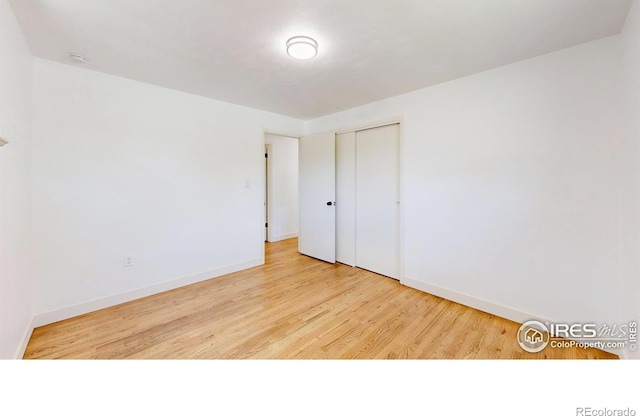 235 N 12th Ave, Brighton, CO 80601 - unfurnished bedroom with wood finished floors and a closet