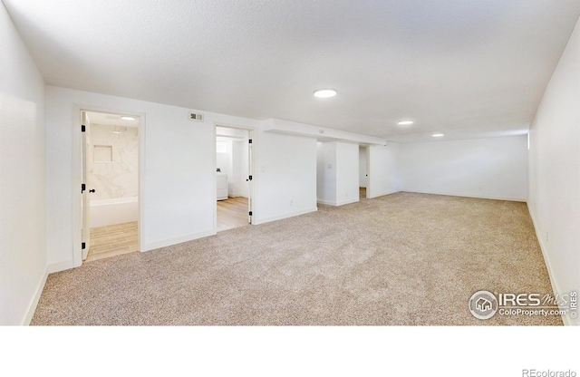 235 N 12th Ave, Brighton, CO 80601 - carpeted empty room with recessed lighting and washer / dryer