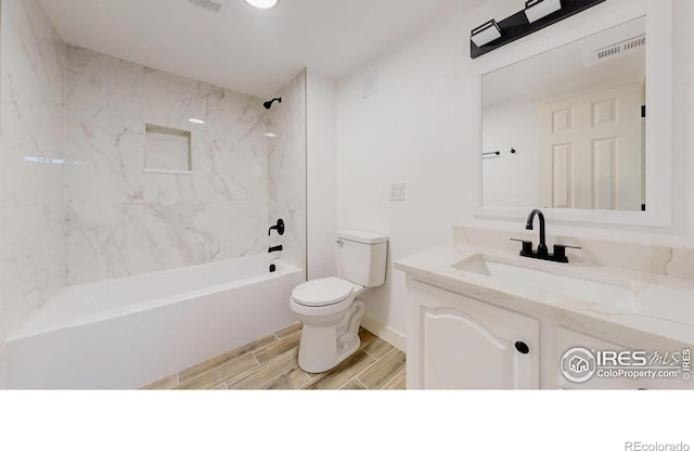 235 N 12th Ave, Brighton, CO 80601 - full bathroom with vanity, shower / washtub combination, and wood tiled floors