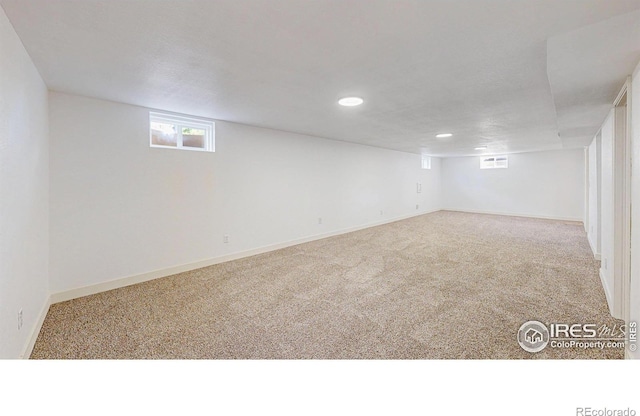 235 N 12th Ave, Brighton, CO 80601 - below grade area featuring carpet flooring, plenty of natural light, and recessed lighting