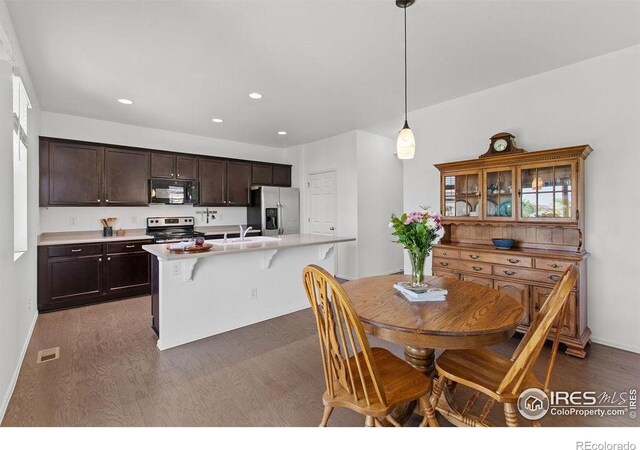 6792 Covenant Ct, Timnath, CO 80547 - dining space with dark wood finished floors and recessed lighting