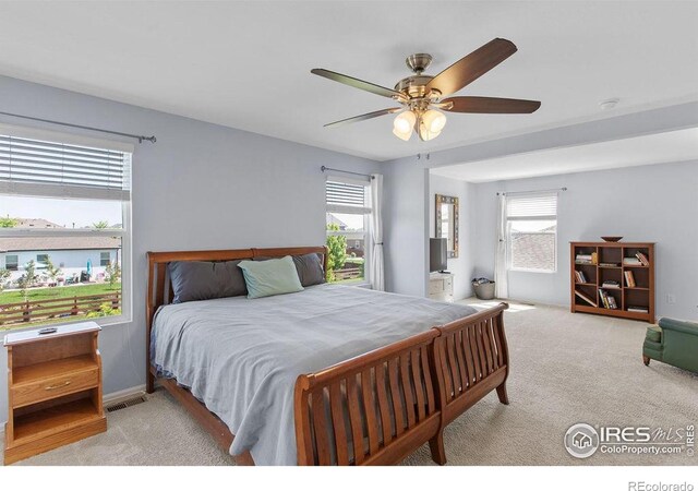 6792 Covenant Ct, Timnath, CO 80547 - bedroom with light carpet and a ceiling fan