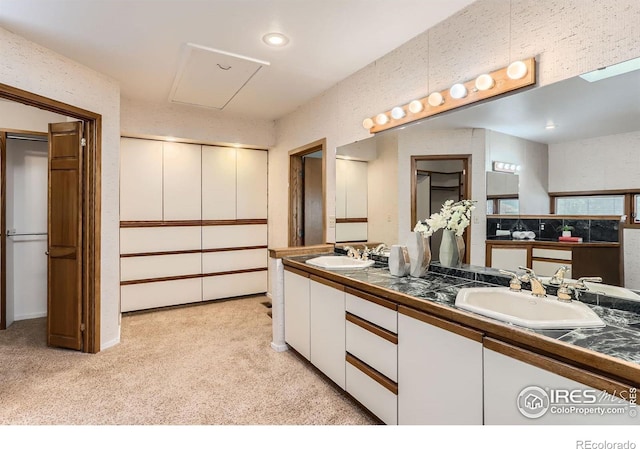 7975 Anchor Dr, Longmont, CO 80504 - bathroom featuring double vanity and carpet flooring