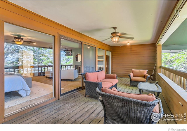 7975 Anchor Dr, Longmont, CO 80504 - deck featuring a ceiling fan and outdoor lounge area