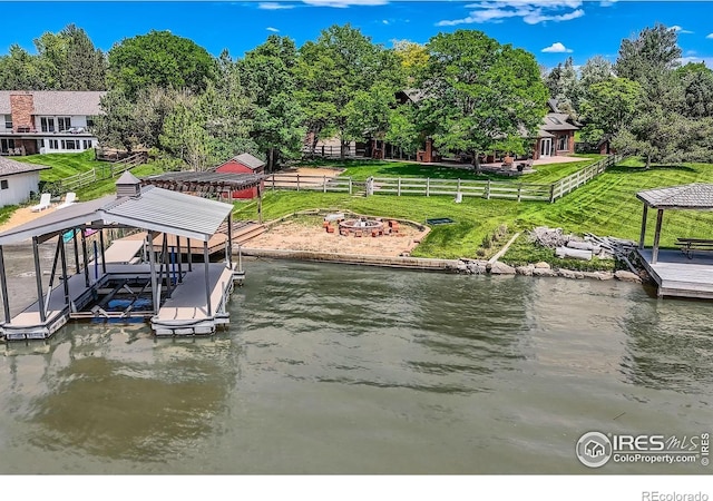 7975 Anchor Dr, Longmont, CO 80504 - dock area featuring a fire pit, boat lift, a water view, and view of scattered trees