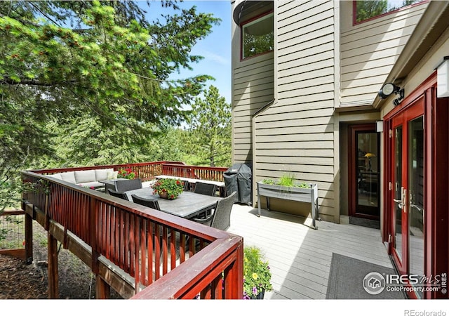 178 Balsam Ln, Boulder, CO 80304 - wooden deck with an outdoor living space, outdoor dining space, and a grill