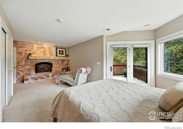 178 Balsam Ln, Boulder, CO 80304 - bedroom with access to outside, a stone fireplace, and carpet flooring