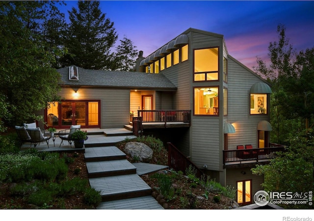 178 Balsam Ln, Boulder, CO 80304 - back of property at dusk with french doors and stairway