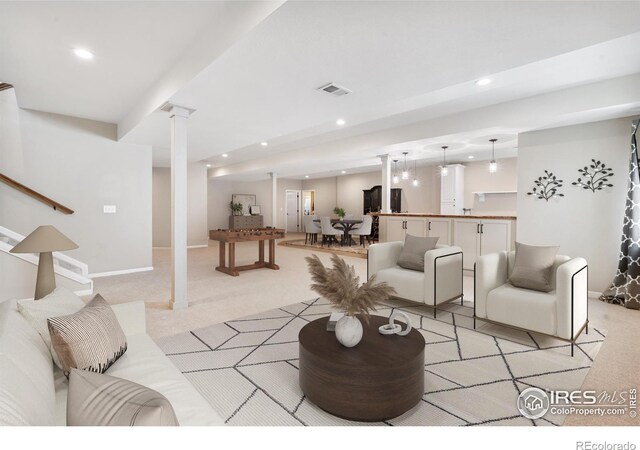 1976 Cayman Dr, Windsor, CO 80550 - living area featuring decorative columns, light carpet, recessed lighting, and stairway