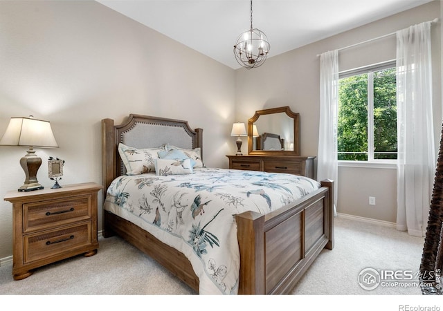 1976 Cayman Dr, Windsor, CO 80550 - bedroom featuring light colored carpet and a chandelier