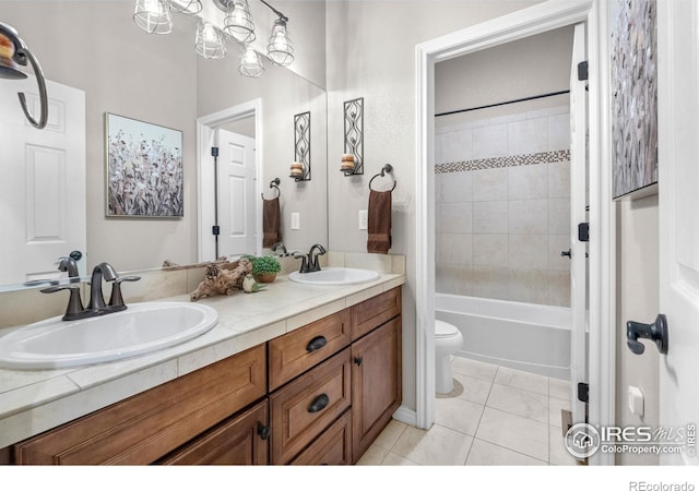 1976 Cayman Dr, Windsor, CO 80550 - bathroom featuring double vanity, tile patterned flooring, and washtub / shower combination