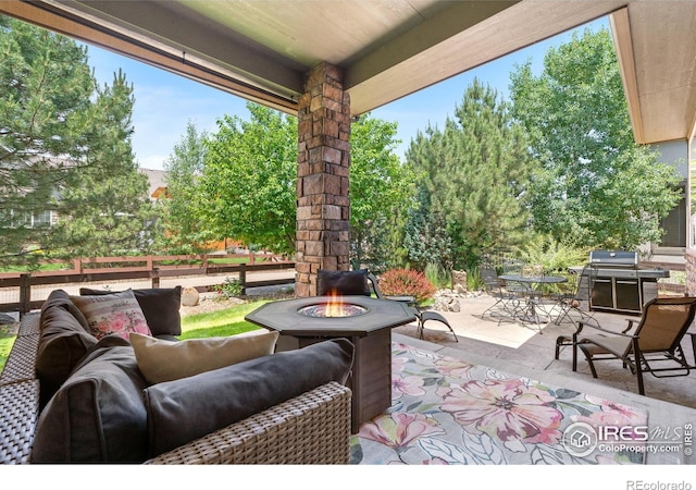 1976 Cayman Dr, Windsor, CO 80550 - view of patio featuring a grill, outdoor dining area, and an outdoor living space with a fire pit