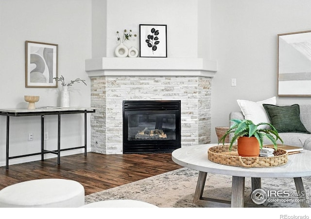 1662 Crestview Ln, Erie, CO 80516 - living area with wood finished floors and a stone fireplace