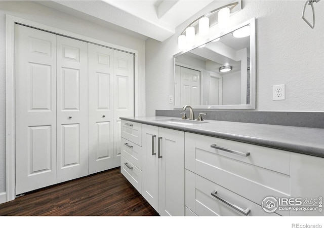 1662 Crestview Ln, Erie, CO 80516 - bathroom featuring vanity, wood finished floors, and a closet