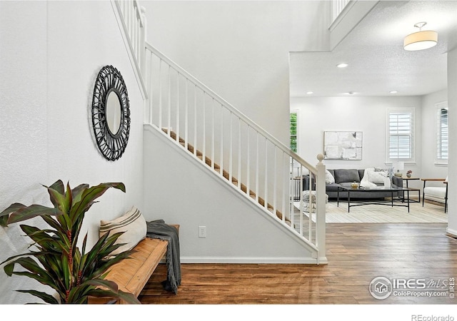 1662 Crestview Ln, Erie, CO 80516 - stairs featuring wood finished floors and recessed lighting