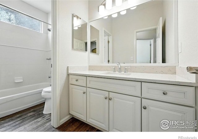 1662 Crestview Ln, Erie, CO 80516 - full bathroom with wood finished floors, vanity, and  shower combination
