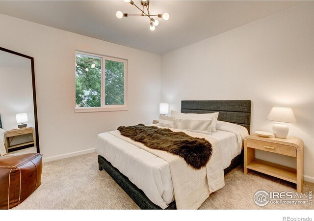 1206 Dawn Ave, Gilcrest, CO 80623 - bedroom featuring light carpet and a chandelier