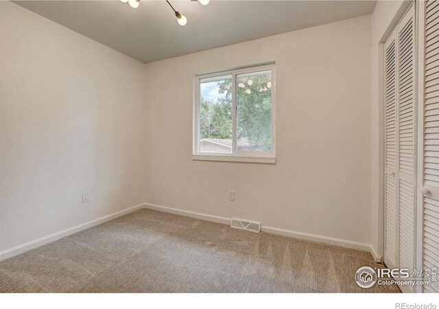 1206 Dawn Ave, Gilcrest, CO 80623 - unfurnished bedroom featuring carpet flooring and a closet