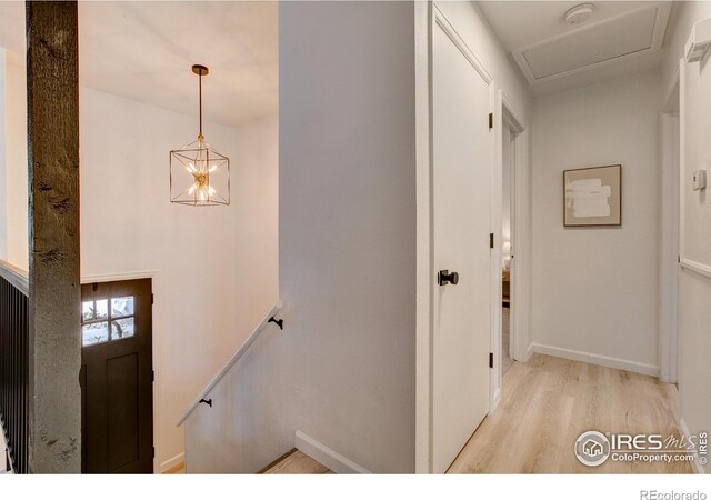 1206 Dawn Ave, Gilcrest, CO 80623 - foyer with wood finished floors and a chandelier