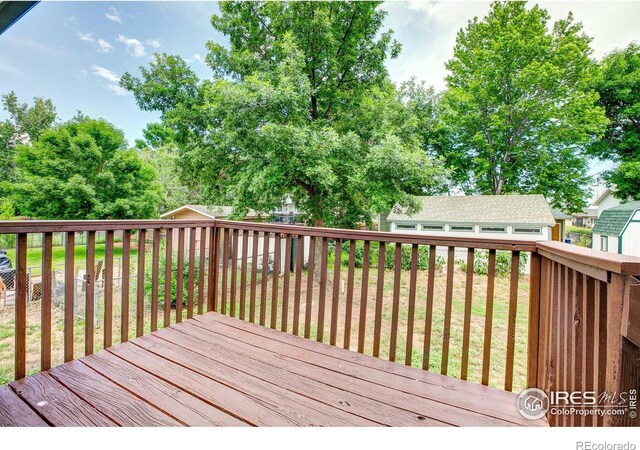 1206 Dawn Ave, Gilcrest, CO 80623 - wooden deck with an outbuilding