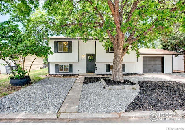 1206 Dawn Ave, Gilcrest, CO 80623 - raised ranch featuring an attached garage and driveway